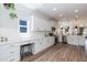 Bright kitchen featuring white cabinetry, stainless steel appliances, and elegant countertops at 1223 Brown Velvet Ln, Apex, NC 27523