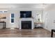 Comfortable living room featuring a fireplace and hardwood floors at 1223 Brown Velvet Ln, Apex, NC 27523