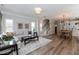 Spacious living room featuring hardwood floors and an open layout at 1223 Brown Velvet Ln, Apex, NC 27523