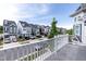 View from balcony of neighborhood street with various home exteriors and parked cars on a sunny day at 1223 Brown Velvet Ln, Apex, NC 27523
