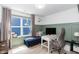 Home office with wainscoting, a large window with blue exterior view and a work space at 1223 Brown Velvet Ln, Apex, NC 27523