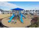 Community playground with slides and shade canopies nestled in a grassy area surrounded by community homes at 1223 Brown Velvet Ln, Apex, NC 27523