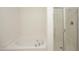 Bright bathroom features a soaking tub and walk-in shower at 12306 Mossgreen St, Raleigh, NC 27614