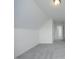 A carpeted bonus room featuring neutral walls, offering a flexible space for various uses at 12306 Mossgreen St, Raleigh, NC 27614