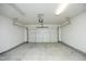 A clean and spacious garage provides ample parking and storage with a garage door at 12306 Mossgreen St, Raleigh, NC 27614