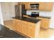 Kitchen with stainless steel appliances, granite counters, and a central island at 12306 Mossgreen St, Raleigh, NC 27614
