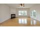 Spacious living room features hardwood floors, a fireplace, and ample natural light at 12306 Mossgreen St, Raleigh, NC 27614