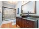 Bathroom featuring a wood vanity, a vessel sink, and a shower with a glass door at 12733 Pamplona Dr, Wake Forest, NC 27587