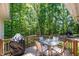 Outdoor deck with seating and dining furniture perfect for enjoying the wooded scenery at 12733 Pamplona Dr, Wake Forest, NC 27587