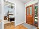Entryway with hardwood floors and a view of the main bedroom at 12733 Pamplona Dr, Wake Forest, NC 27587