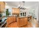 Bright kitchen with maple cabinets, granite countertops, and a stainless steel dishwasher at 12733 Pamplona Dr, Wake Forest, NC 27587