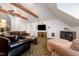 Large entertainment room with comfortable seating, fireplace, and a flat-screen TV for relaxing evenings at 12733 Pamplona Dr, Wake Forest, NC 27587