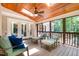 Inviting screened-in porch with skylights, wood ceilings, and comfortable seating area at 12733 Pamplona Dr, Wake Forest, NC 27587
