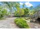 Expansive backyard featuring mature trees and a well-maintained garden area at 1314 Glendale Ave, Durham, NC 27701