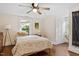 Bright bedroom with a ceiling fan and hardwood floors at 1314 Glendale Ave, Durham, NC 27701