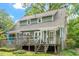This cozy home boasts a charming wooden deck and stairway leading to the backyard at 1314 Glendale Ave, Durham, NC 27701