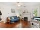 Inviting living room boasts hardwood floors, large windows, and a decorative fireplace at 1314 Glendale Ave, Durham, NC 27701