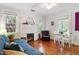 Inviting living room boasts hardwood floors, fireplace, and natural light at 1314 Glendale Ave, Durham, NC 27701