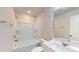 Well-lit bathroom with a shower-tub combo and vanity featuring modern fixtures at 1314 Rosepine Dr, Cary, NC 27519