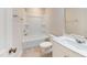 Bathroom featuring a tub and shower, toilet, modern vanity with white countertop, and wood look floor at 1314 Rosepine Dr, Cary, NC 27519