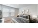 Bedroom with window, plush carpet, neutral decor, and artwork adding character to the space at 1314 Rosepine Dr, Cary, NC 27519