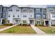 Charming townhouse with colorful exteriors, manicured lawn, and inviting walkways at 1314 Rosepine Dr, Cary, NC 27519