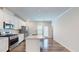 Spacious kitchen featuring stainless appliances, white cabinetry, and eat in space at 1314 Rosepine Dr, Cary, NC 27519
