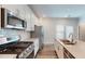 Open concept kitchen with stainless steel appliances and granite countertops at 1314 Rosepine Dr, Cary, NC 27519