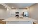 Well-equipped kitchen with stainless appliances, island, and white cabinets at 1314 Rosepine Dr, Cary, NC 27519