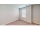 Clean carpeted room featuring neutral paint and a bright window at 1314 Rosepine Dr, Cary, NC 27519