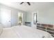 Inviting bedroom showcases a large bed, ceiling fan, and view into the attached bathroom at 1316 Garden Crest Cir, Raleigh, NC 27609