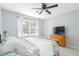 Bedroom with natural light features a large window and a comfortable queen-sized bed at 1316 Garden Crest Cir, Raleigh, NC 27609