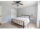 Cozy bedroom features neutral walls, ceiling fan, and a double bed with side tables at 1316 Garden Crest Cir, Raleigh, NC 27609