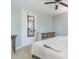 Cozy bedroom includes a comfy bed, ceiling fan, and rustic dresser against soft blue walls at 1316 Garden Crest Cir, Raleigh, NC 27609