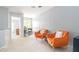 Spacious bonus room features carpet, natural light, and two armchairs at 1316 Garden Crest Cir, Raleigh, NC 27609