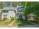 Charming townhome with manicured lawn and colorful flowerbeds enhancing its curb appeal at 1316 Garden Crest Cir, Raleigh, NC 27609