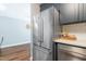 The kitchen features stainless steel refrigerator and plentiful cabinets at 1316 Garden Crest Cir, Raleigh, NC 27609
