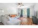 Inviting living room with hardwood floors, a ceiling fan, and natural light at 1316 Garden Crest Cir, Raleigh, NC 27609