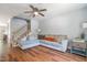 Spacious living room with hardwood floors, cozy seating, and a ceiling fan at 1316 Garden Crest Cir, Raleigh, NC 27609