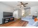 Inviting living room with hardwood floors, a ceiling fan, and natural light at 1316 Garden Crest Cir, Raleigh, NC 27609