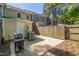 Private outdoor patio with fence, grill and view of the townhome exterior at 1316 Garden Crest Cir, Raleigh, NC 27609