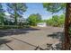 Community tennis court surrounded by lush greenery and mature trees at 1316 Garden Crest Cir, Raleigh, NC 27609