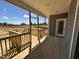 A brand new deck leading to backyard with fresh green grass, neighborhood beyond at 134 Royal Ave, Selma, NC 27576