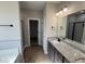Stylish bathroom featuring granite countertops, dual sinks, modern fixtures, and a walk-in shower at 134 Royal Ave, Selma, NC 27576