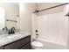Bathroom with granite countertops, and white tub shower at 134 Royal Ave, Selma, NC 27576
