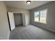 Comfortable bedroom with plush carpet, a window that provides ample natural light and closet space at 134 Royal Ave, Selma, NC 27576