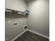 A walk-in closet featuring vinyl flooring, wire shelving, and electrical outlets at 134 Royal Ave, Selma, NC 27576