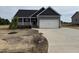 Charming single-Gathering home with a two-car garage and a well-manicured lawn in a residential area at 134 Royal Ave, Selma, NC 27576