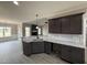 A kitchen with granite countertops, pendant lighting, and easy access to the living and dining areas at 134 Royal Ave, Selma, NC 27576