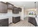 Modern kitchen featuring granite countertops, ample storage and stainless steel sink at 134 Royal Ave, Selma, NC 27576